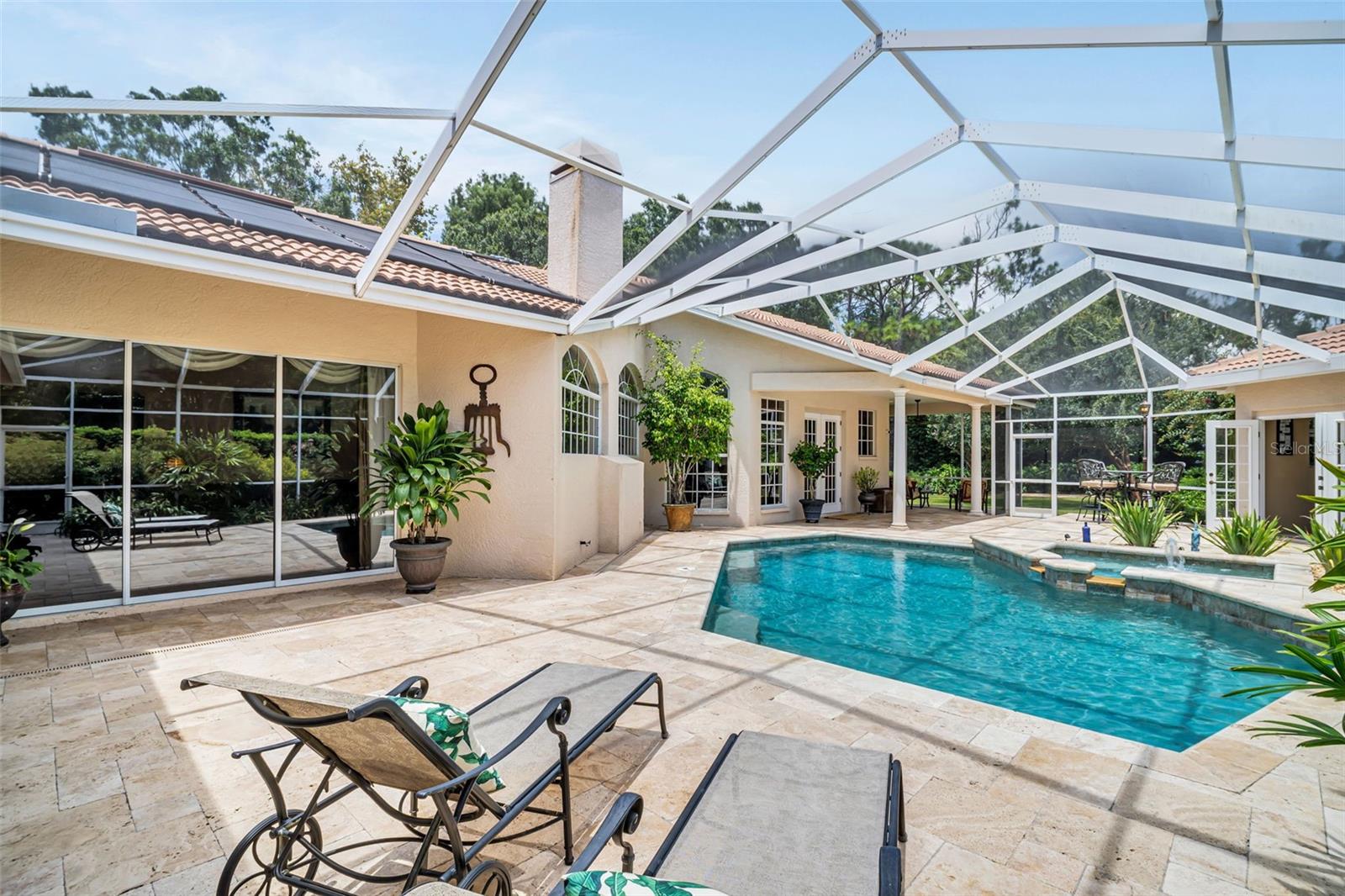 Cabana on right with open doors mother in law/game room to left