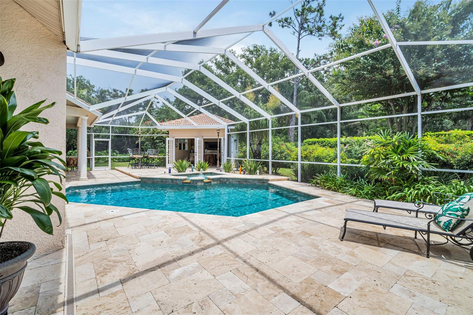 Cabana next to the pool in rear of pool cage..