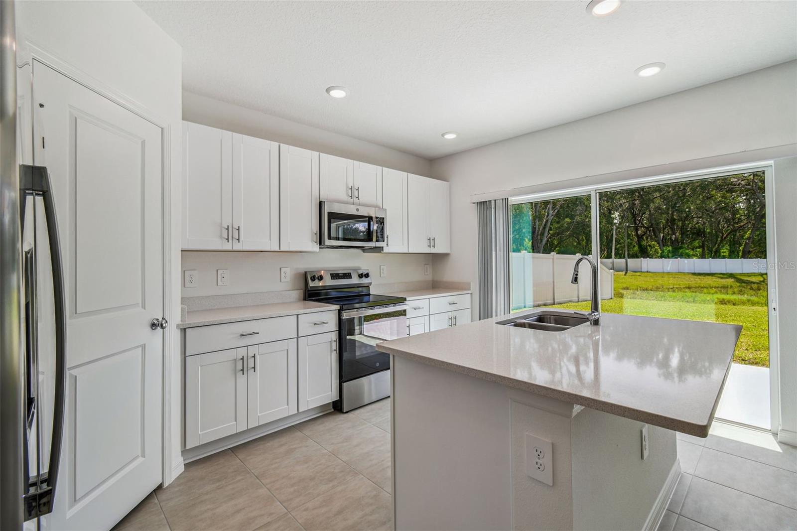 Kitchen w/Sliding Glass Door Access to Patio