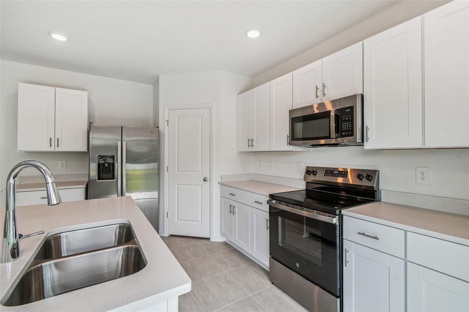Plenty of Cabinetry in Kitchen w/Walk-in Pantry