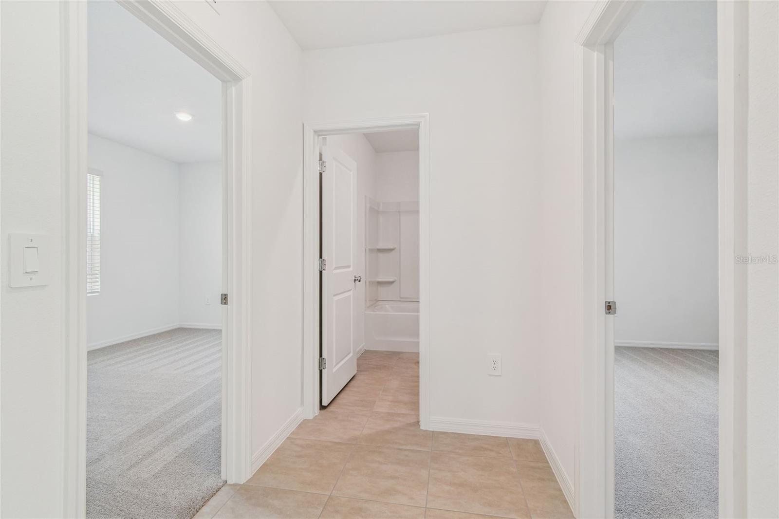 Guest Bedrooms Separated by Guest Bathroom