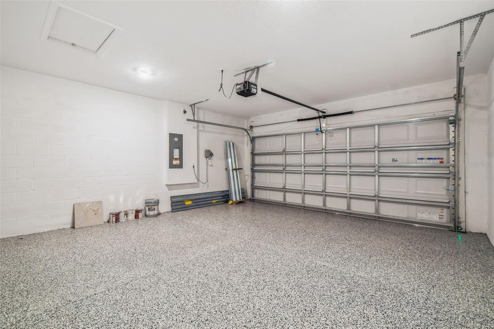 Garage w/Special Epoxy Flooring, Hurricane Shutter Storage & Hurricane-Rated Garage Door