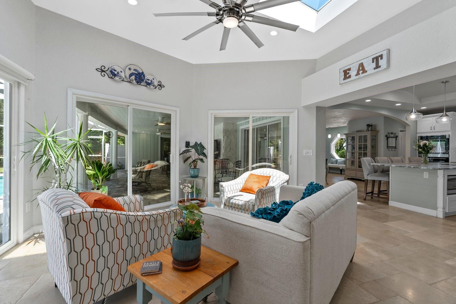 Sun room with skylights off ktichen