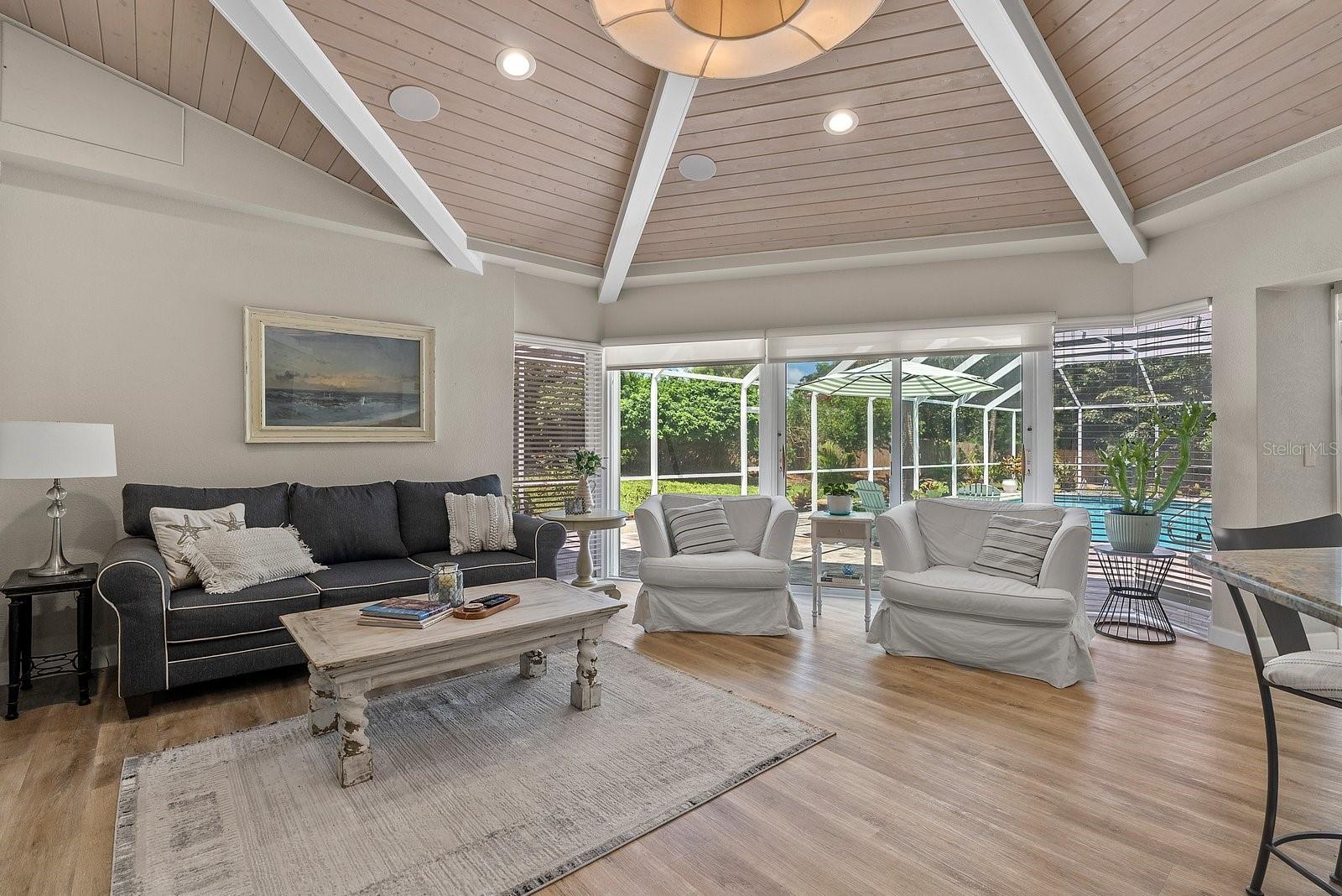 family room has blinds and solar shades