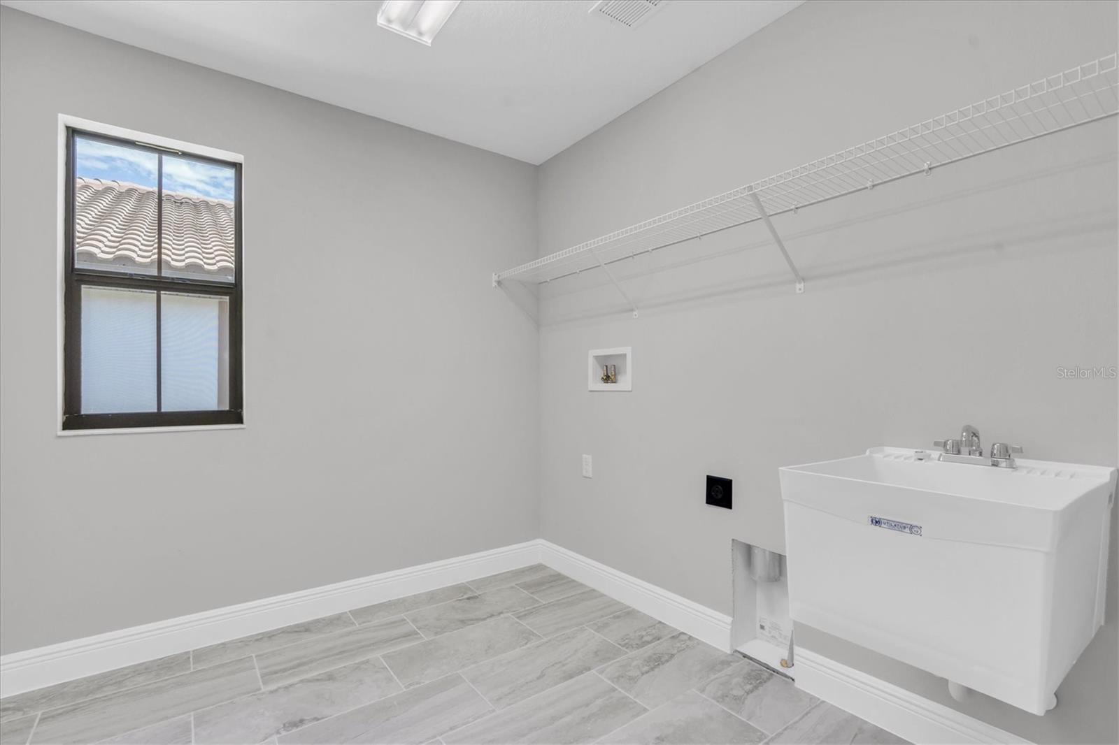 Upstairs laundry room.