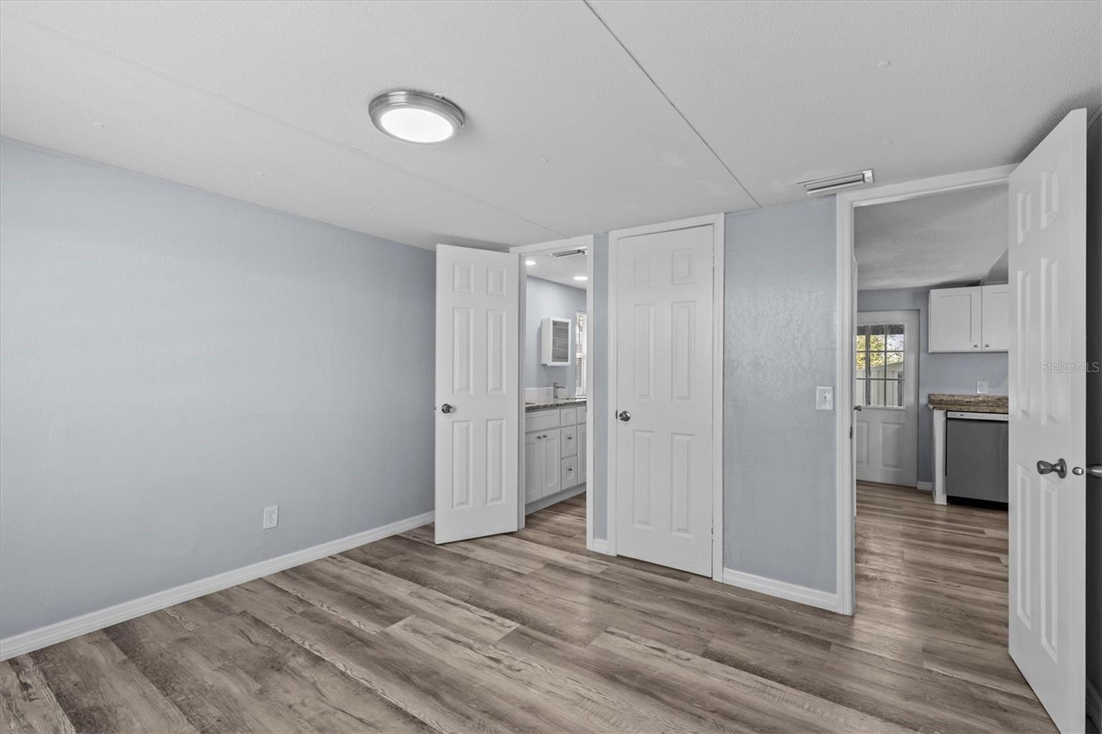 Master Bedroom. Bathroom to the left. Walk in closet in the middle and access to the living room on the third.