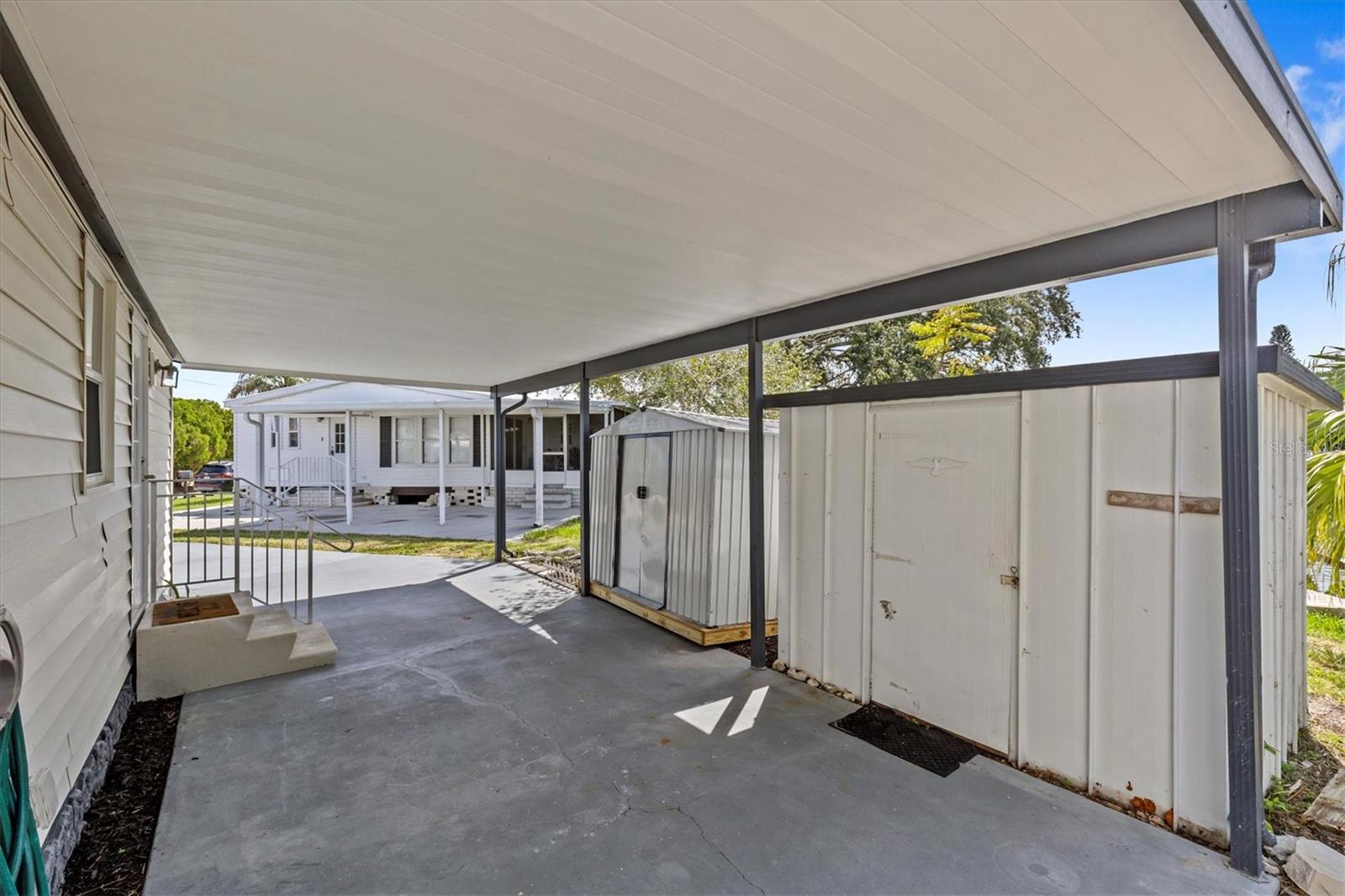 2 storage units along the carport for PLENTY of storage