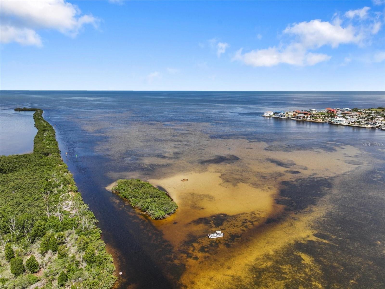 The only island & sandbar in Hudson. Called many names. Red Neck Riveria, Signal Cove Yacht Club, Okey Dokey. A place to meet your neighbors, bring your pups and family to hang on the sandbar or just relax. Located just before you take the channel out to the gulf.
