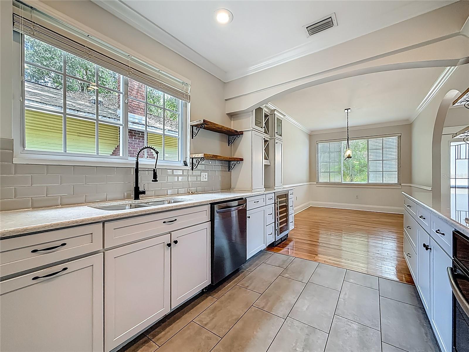 Kitchen, Window, Sink, Bar Area w/ Wine Cooler, View of Dining Rm