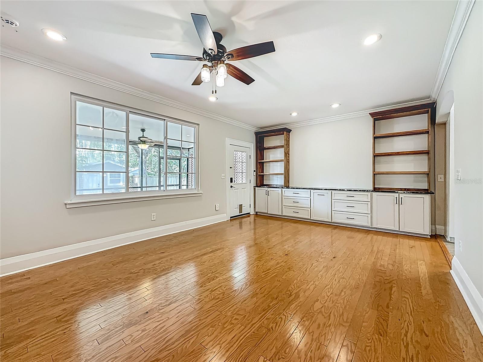 View of Family Rm, Built-in Cabinets, Window w/ view of back Porch