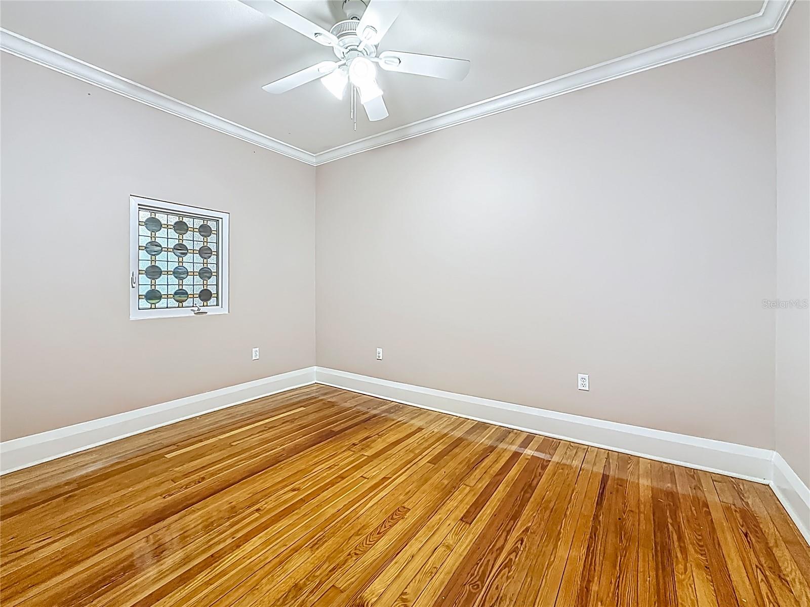 View of 2n Bedroom, Stained Glass Window that opens to Family Rm