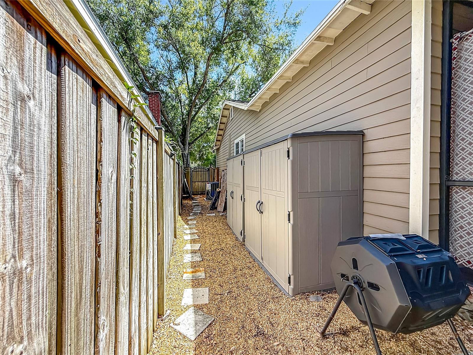 Rear of Property with 3-car Driveway and MIL Suite/Office/Studio on left