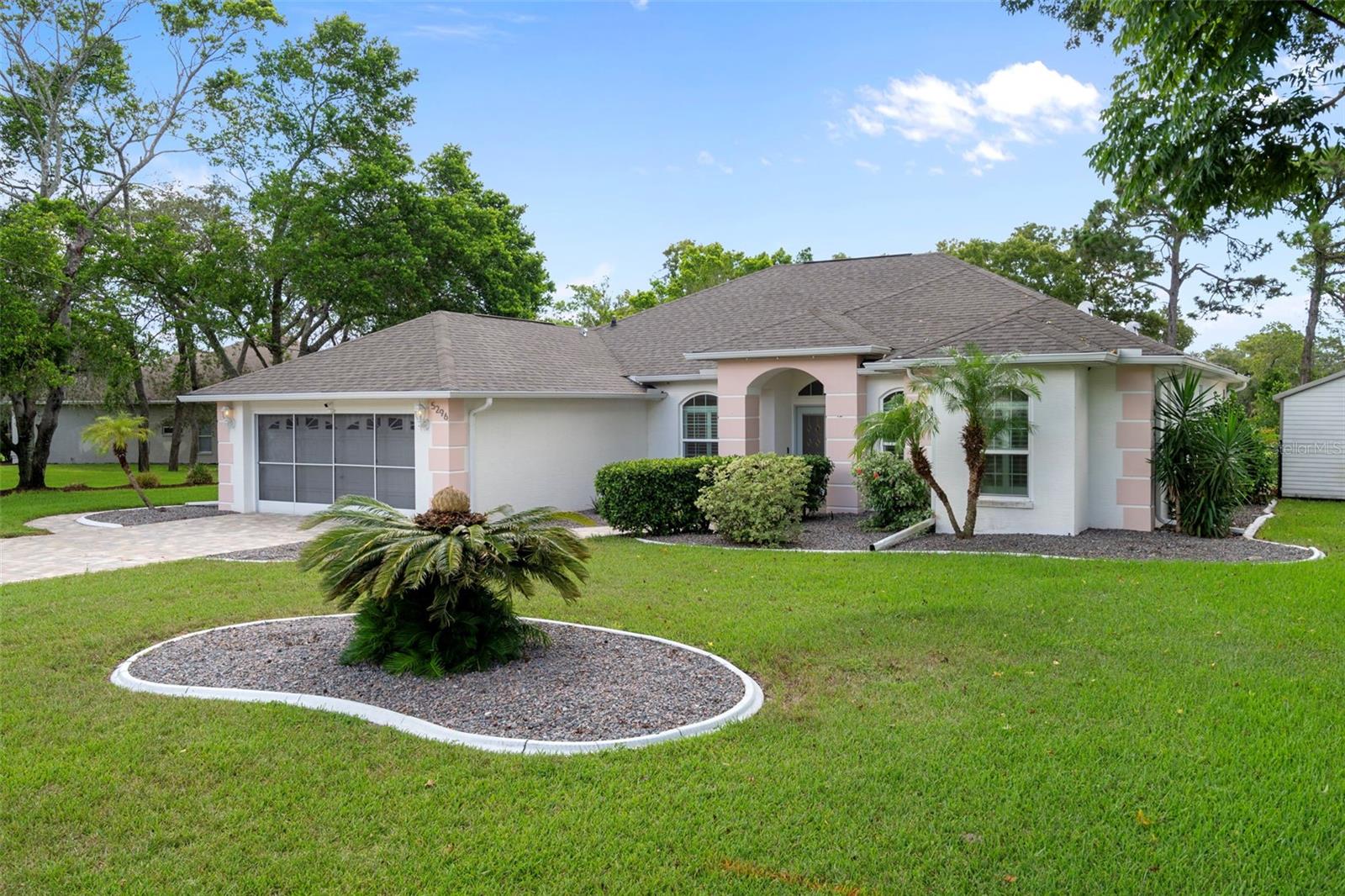 You can't miss the beautiful landscaping with curb a lawn landscape borders around the entire home
