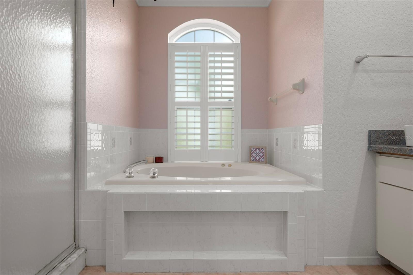 This Gorgeous window provides natural light with plantation shutters