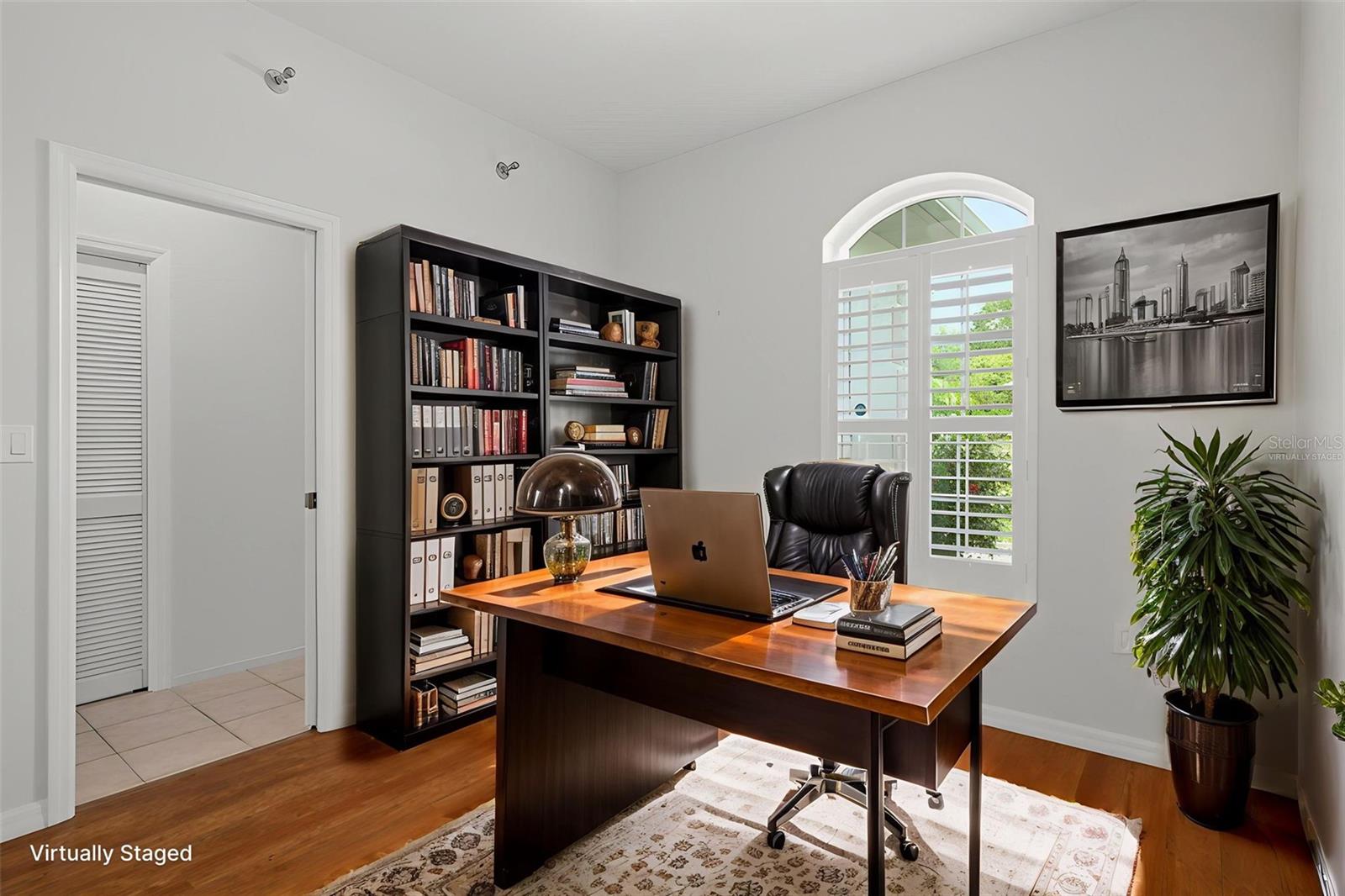 The bonus room is Virtually staged for an office.