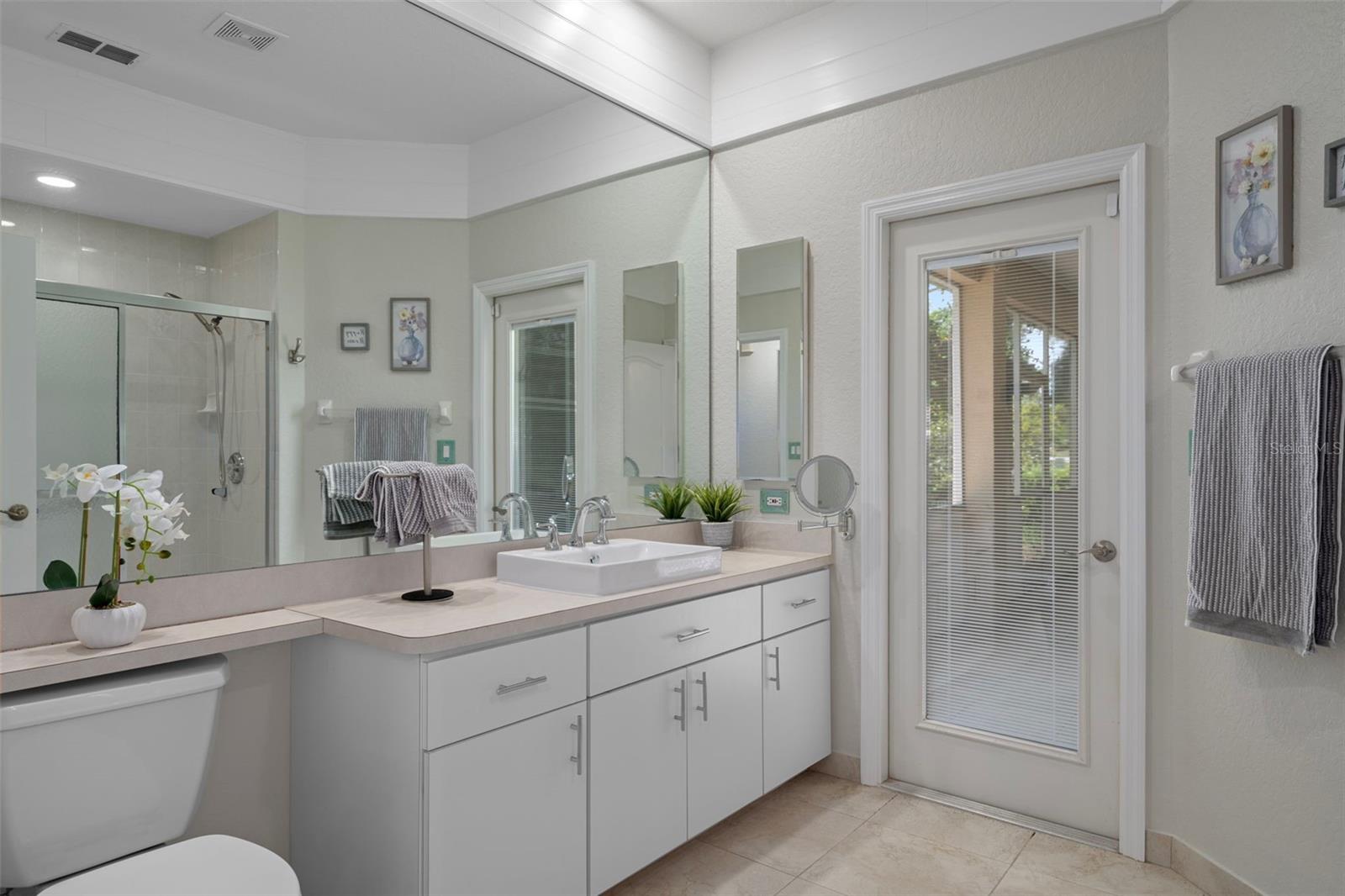 Guest bathroom has a  large vanity and step in shower !