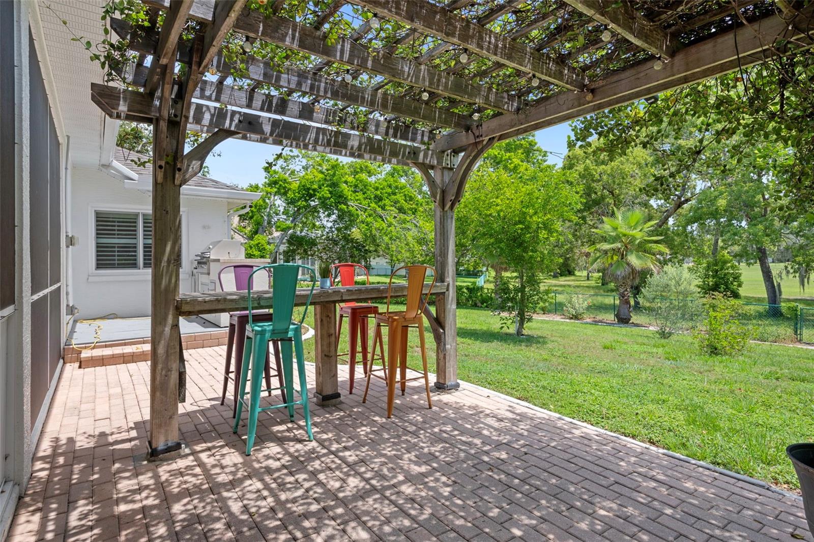 One of the highlights of the backyard is the beautiful Pergola with beautiful vines over it to keep you cool