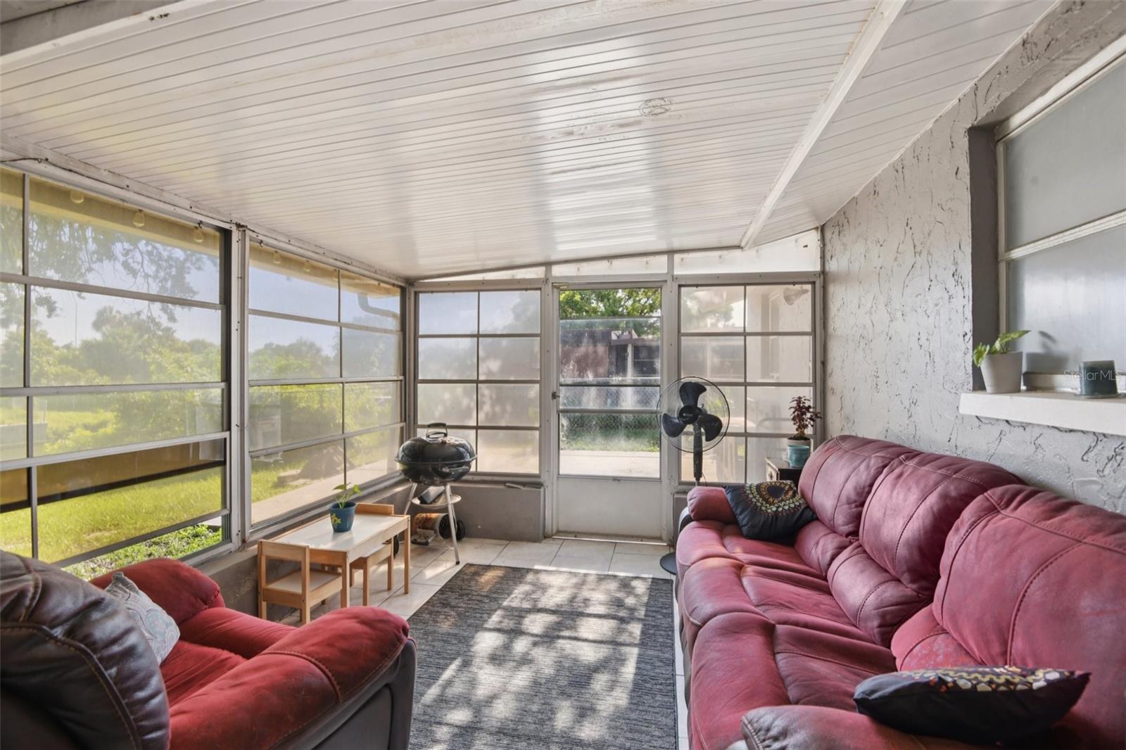 Sunroom leading out to backyard patio
