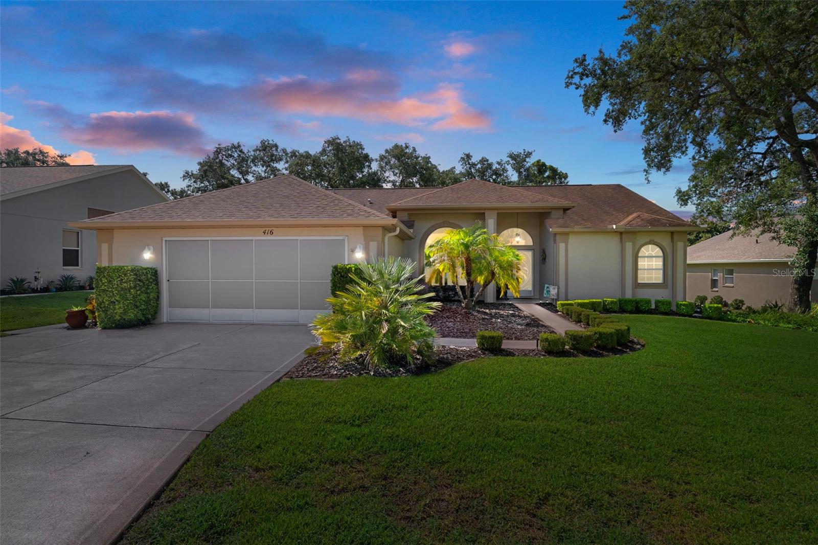 The twilight really shows this home's natural curb appeal.