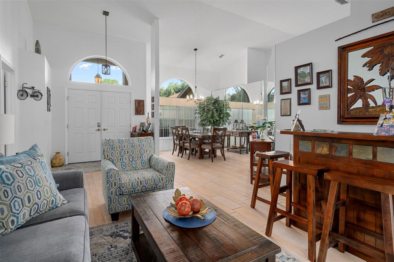 The dinning room can be viewed from the living room with continued wood look tile flooring.