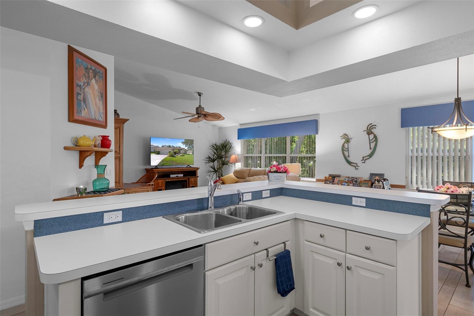 Large stainless steel sink helps to make dishes a breeze.