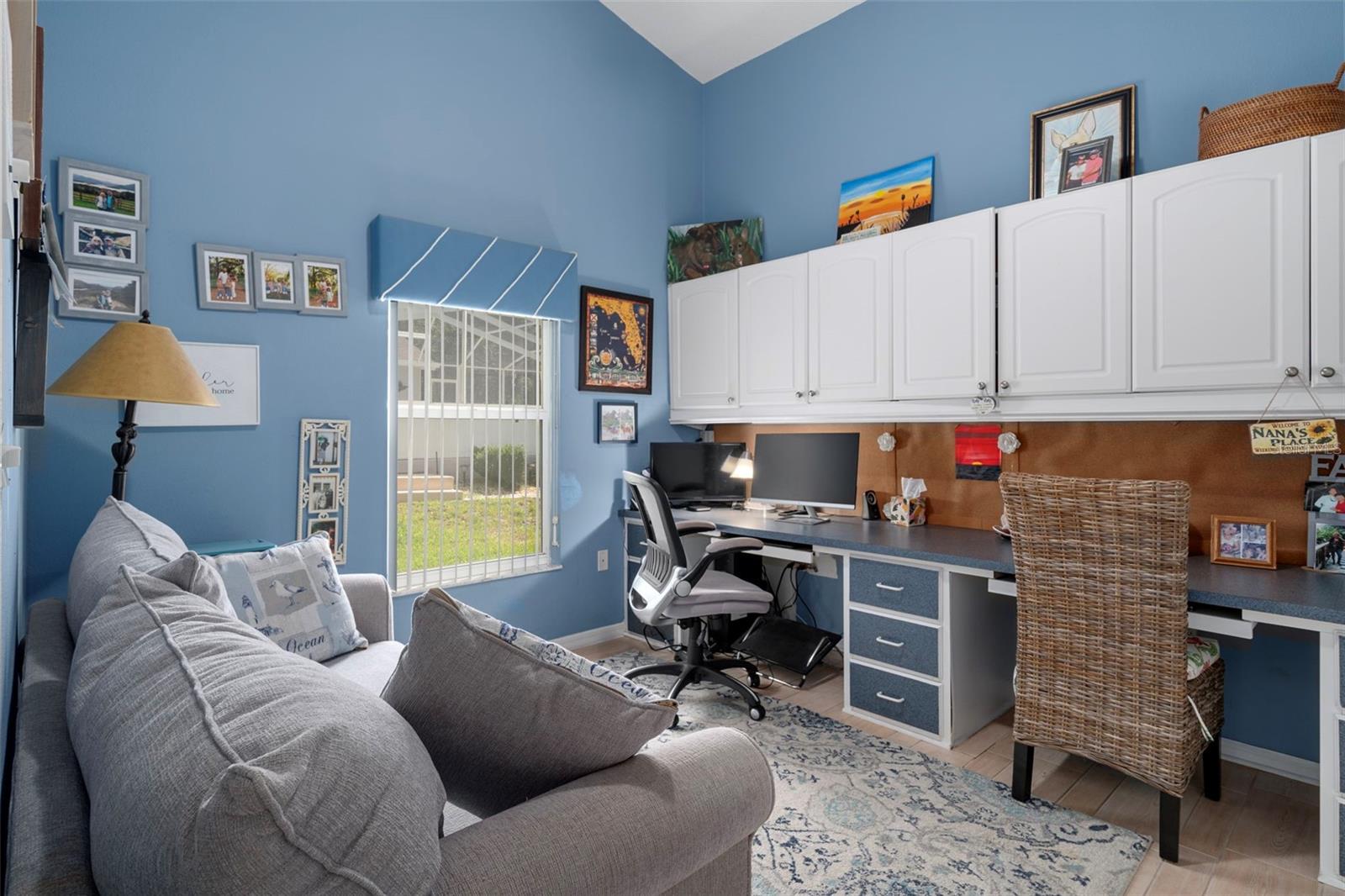This guest bedroom is already set up for your home office.