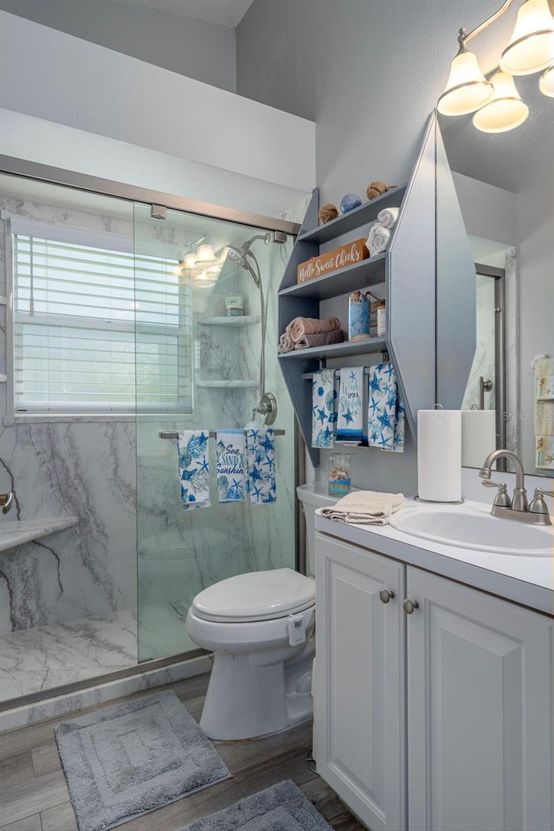 High ceilings make this bathroom feel very spacious.