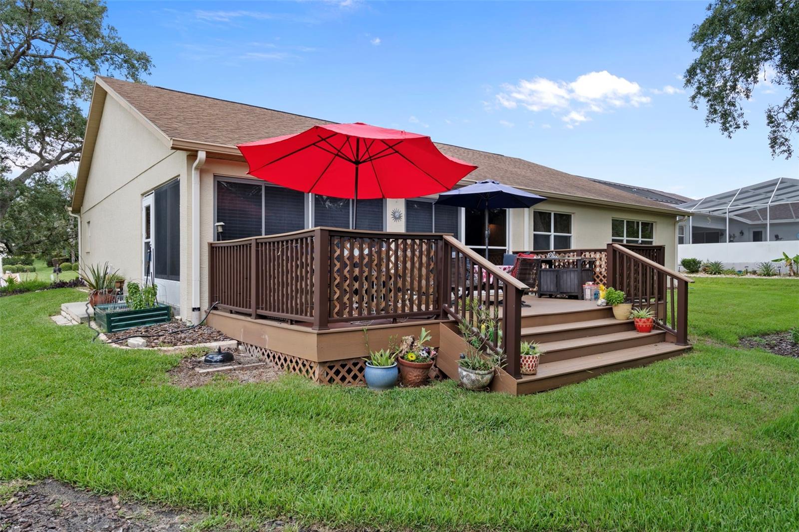 Nice wide steps with decorative railing lines the deck.