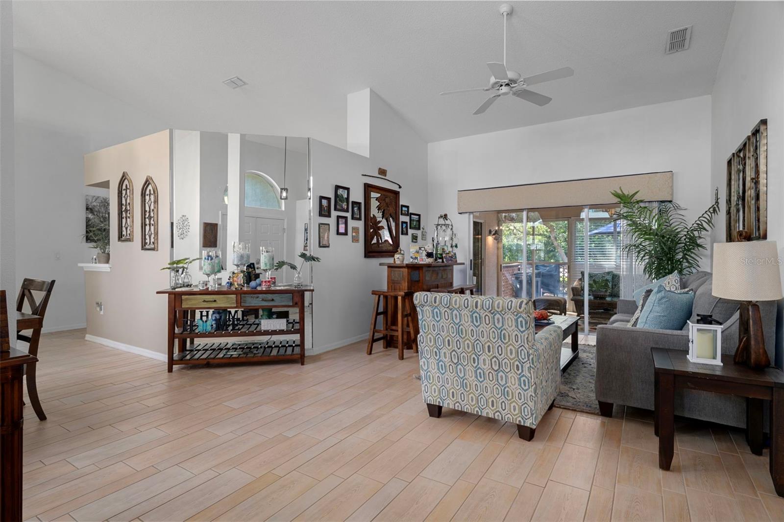 Walk into your new living room equipped with gorgeous wood look tile flooring.