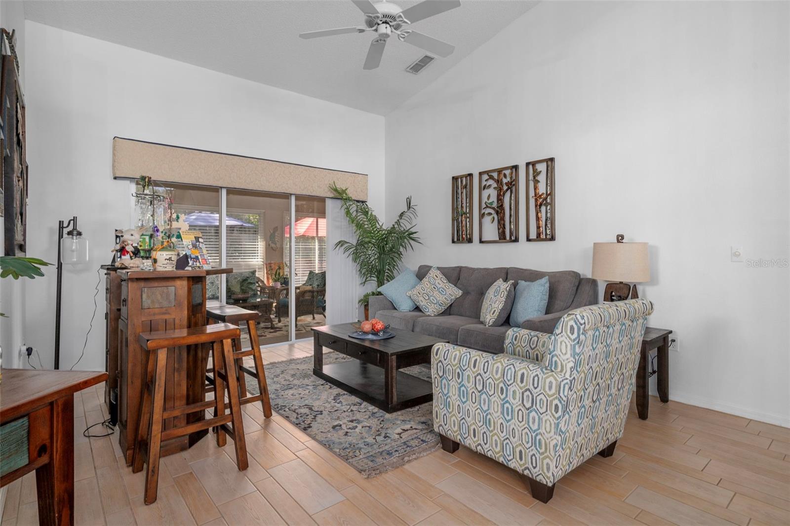 Sliding glass door provides a view to the enclosed Lanai