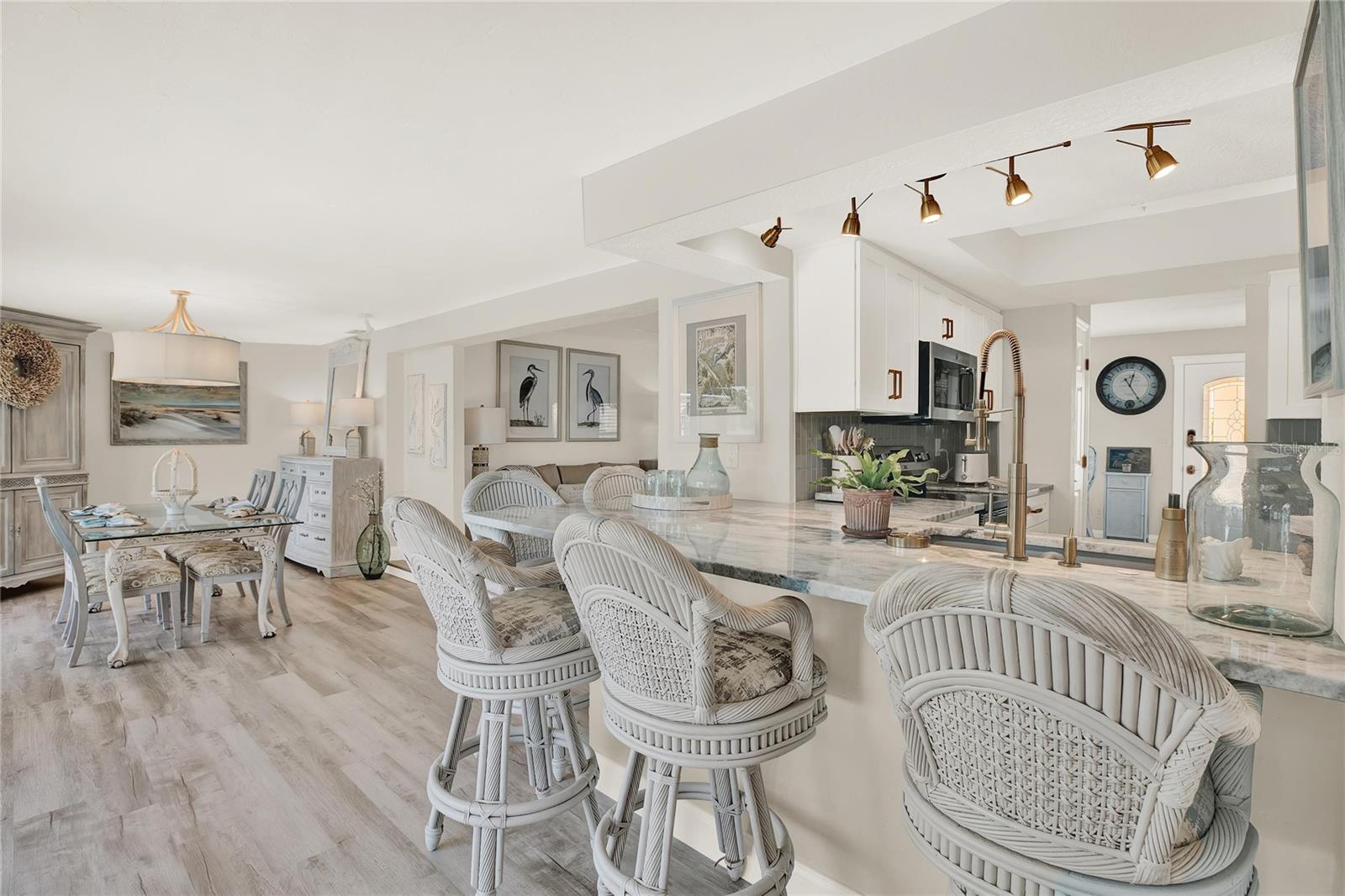 Kitchen opens to the bar area & open to the dining area.  Water views abound