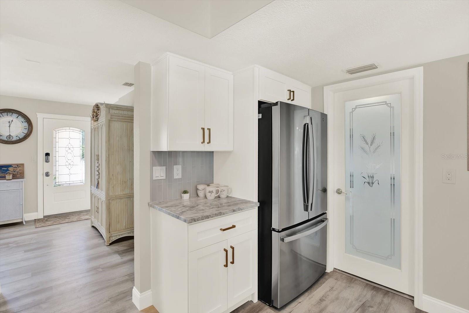 Kitchen also has a pantry not seen here.  Glass door leads to garage.