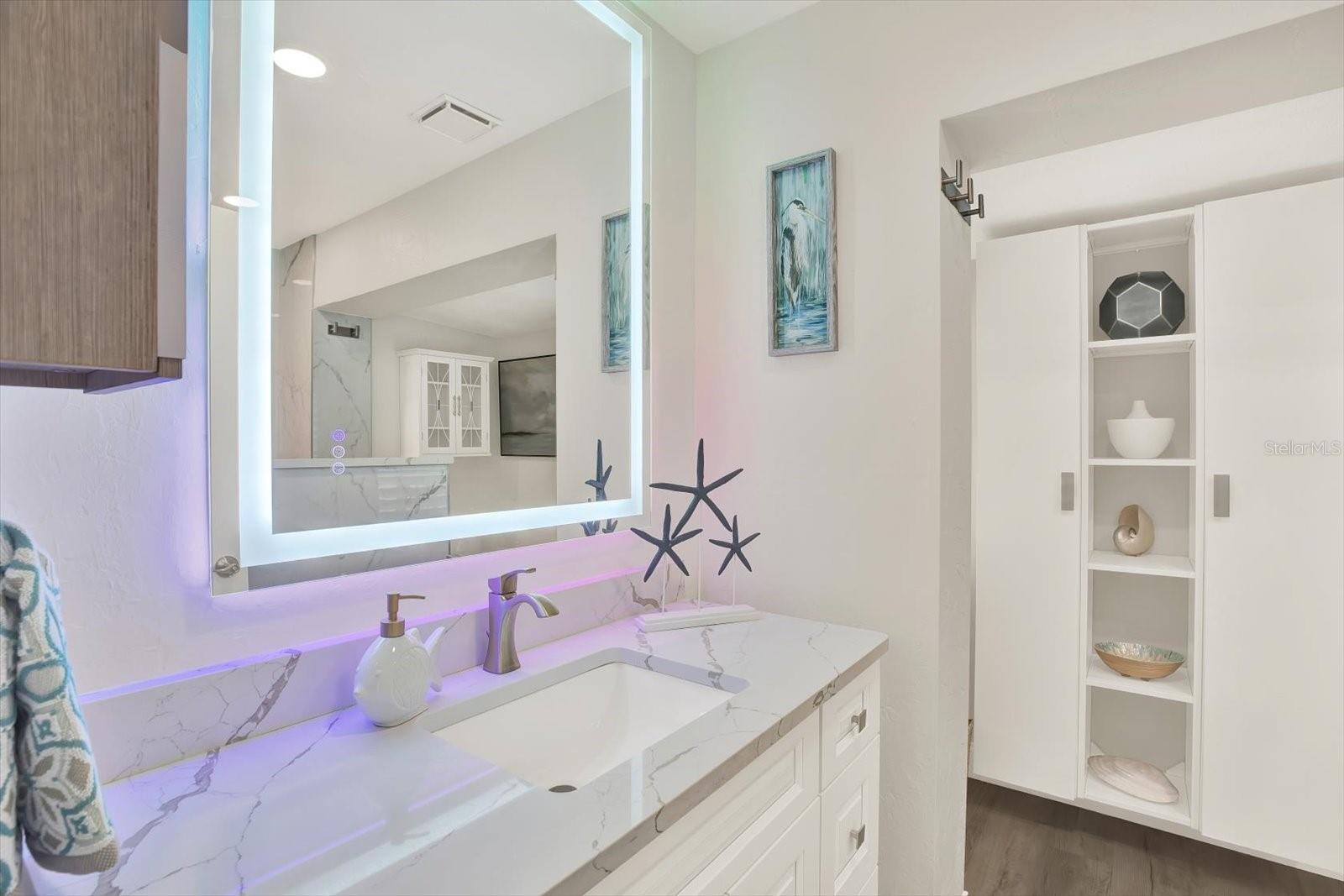 Guest Bath is very spacious with a spa shower & mirrors that are "touch to light and touch to defrost"