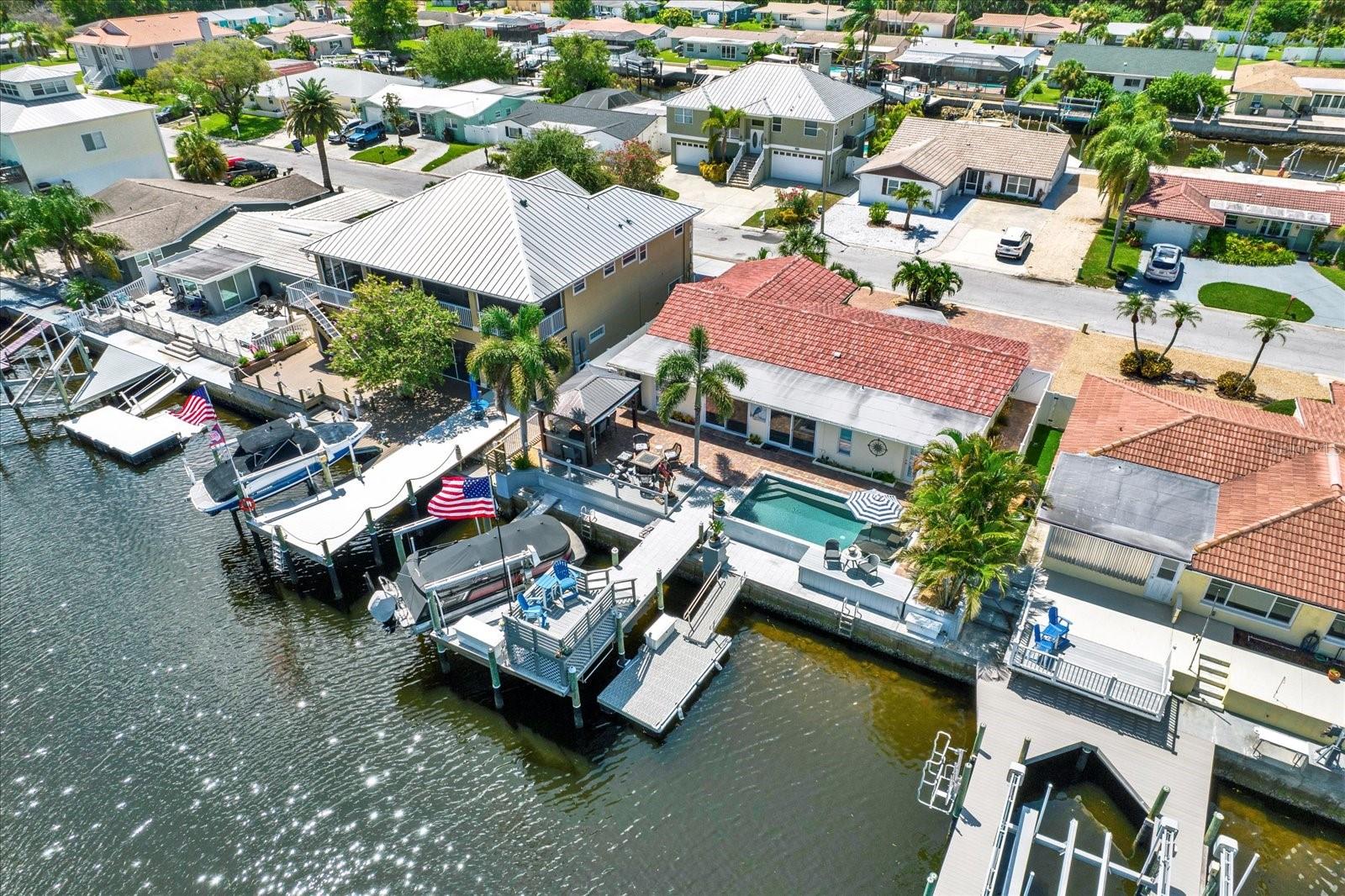 Dock has lift, stationary and floating.  Deep wide channel.  No bridges to open gulf.