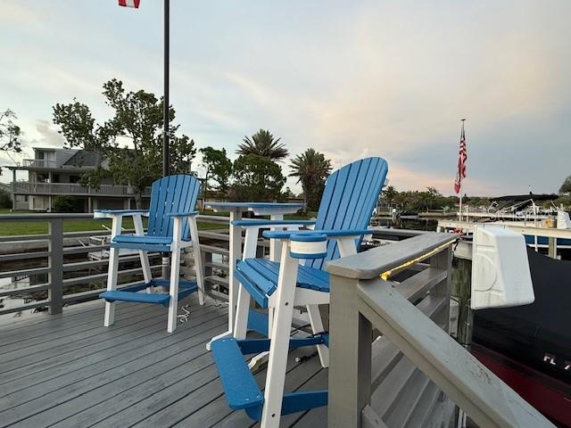 Cranes Roost private raised deck for sunset views & watching manatee + dolphins.  High end custom chairs included !