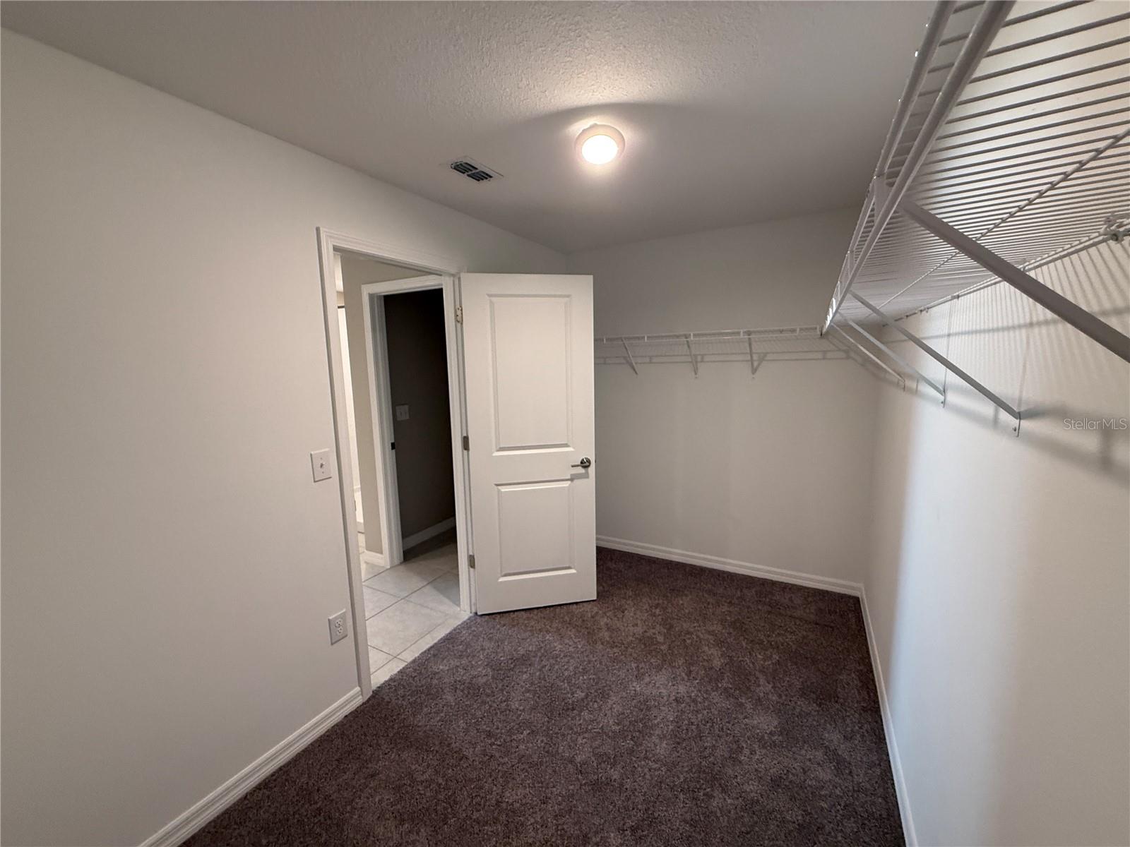 walk-in closet in primary bedroom.