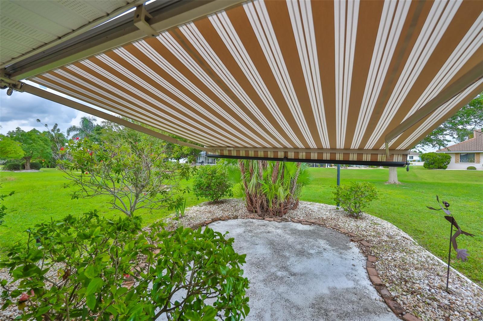 Rear patio with awning extended and garden