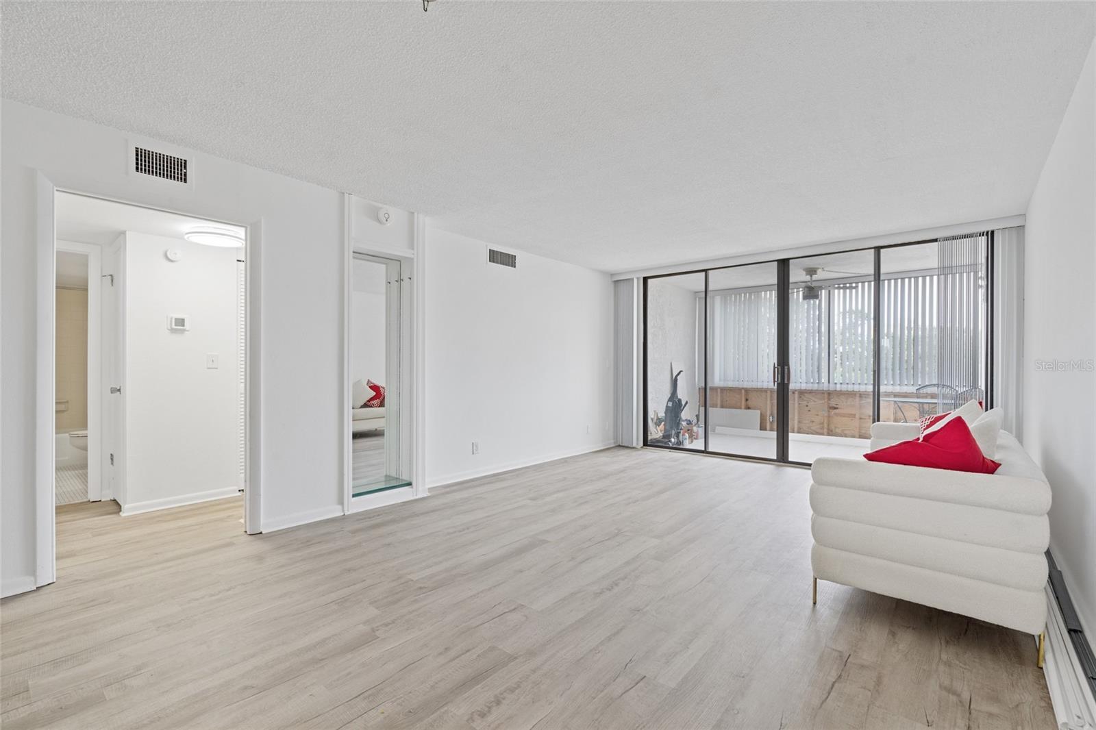 Living room opens up to the balcony.