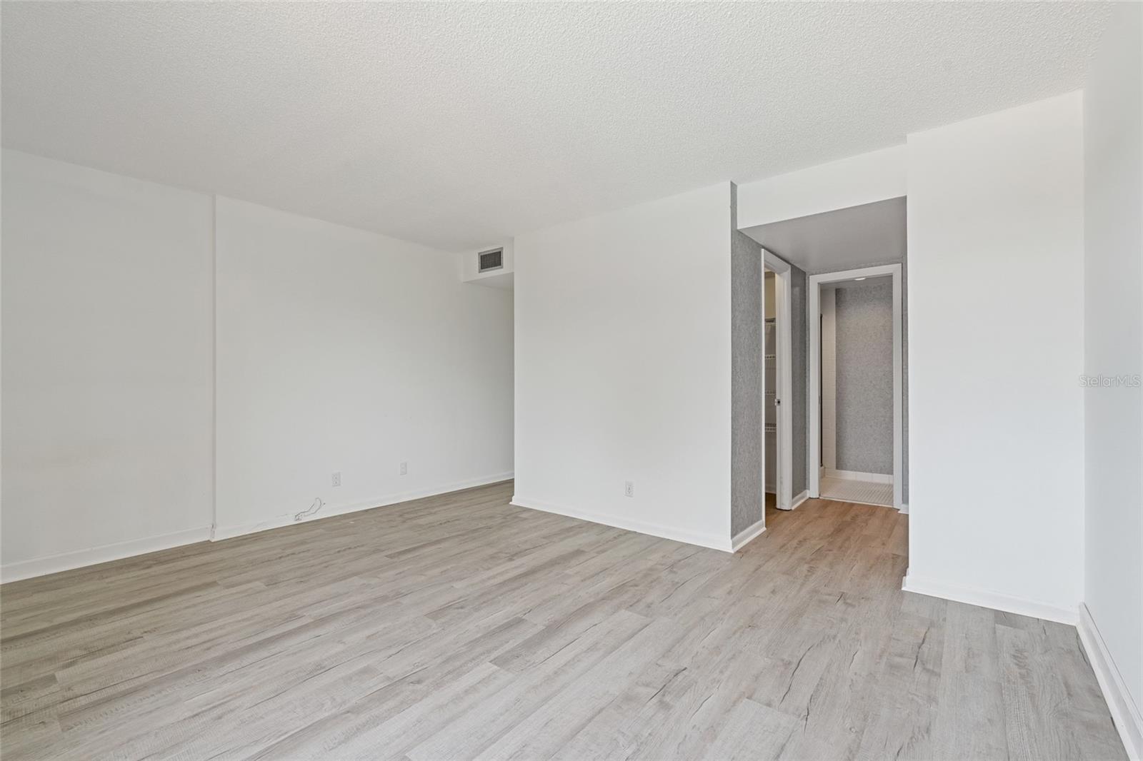 Primary bedroom has its own bathroom and walk-in closet.