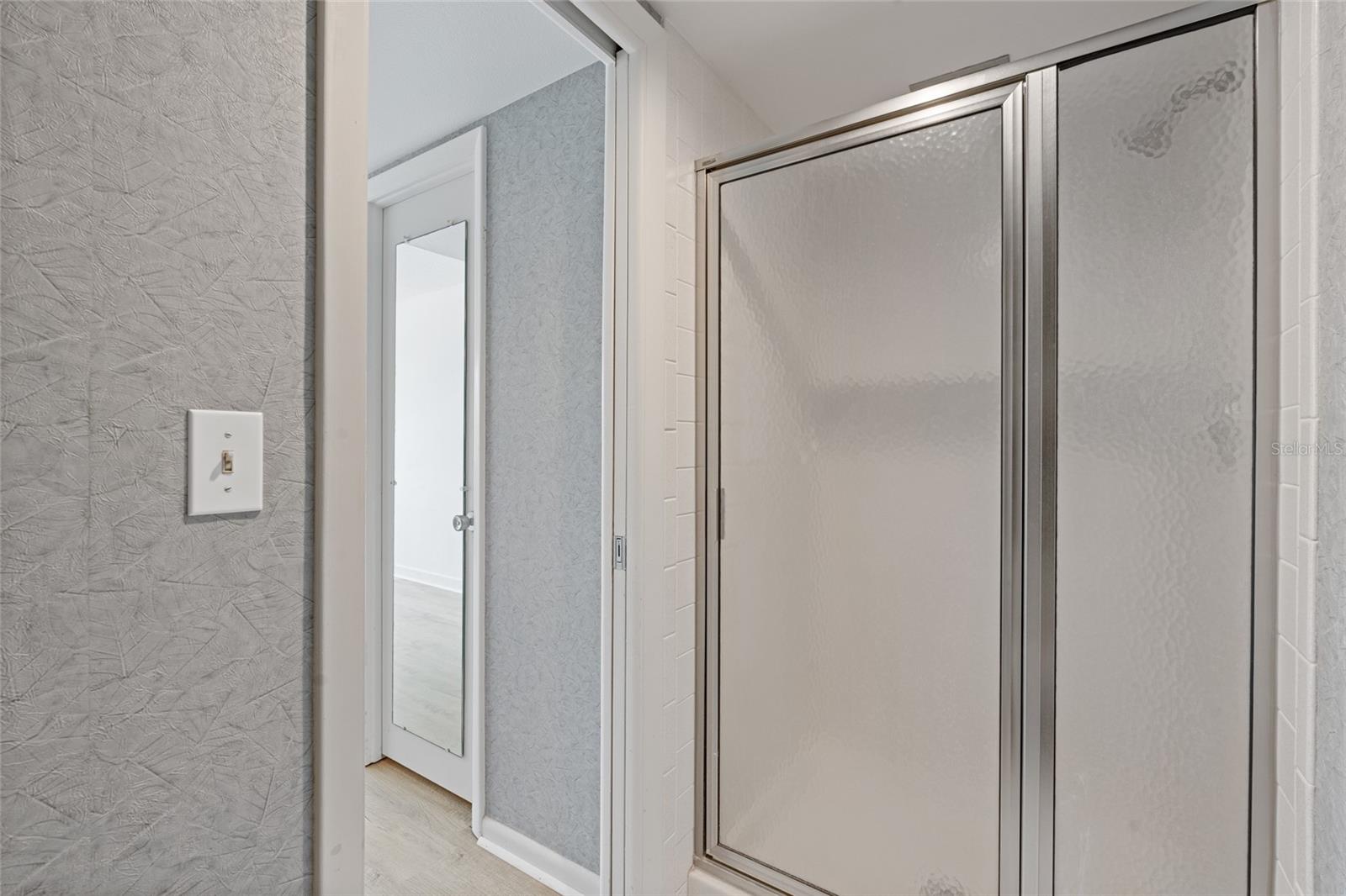 Primary bathroom has a shower stall.