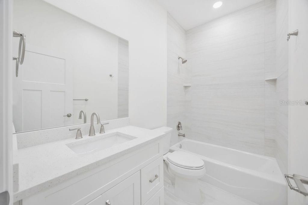 Guest bath with cast iron tub, outside of bedroom 3