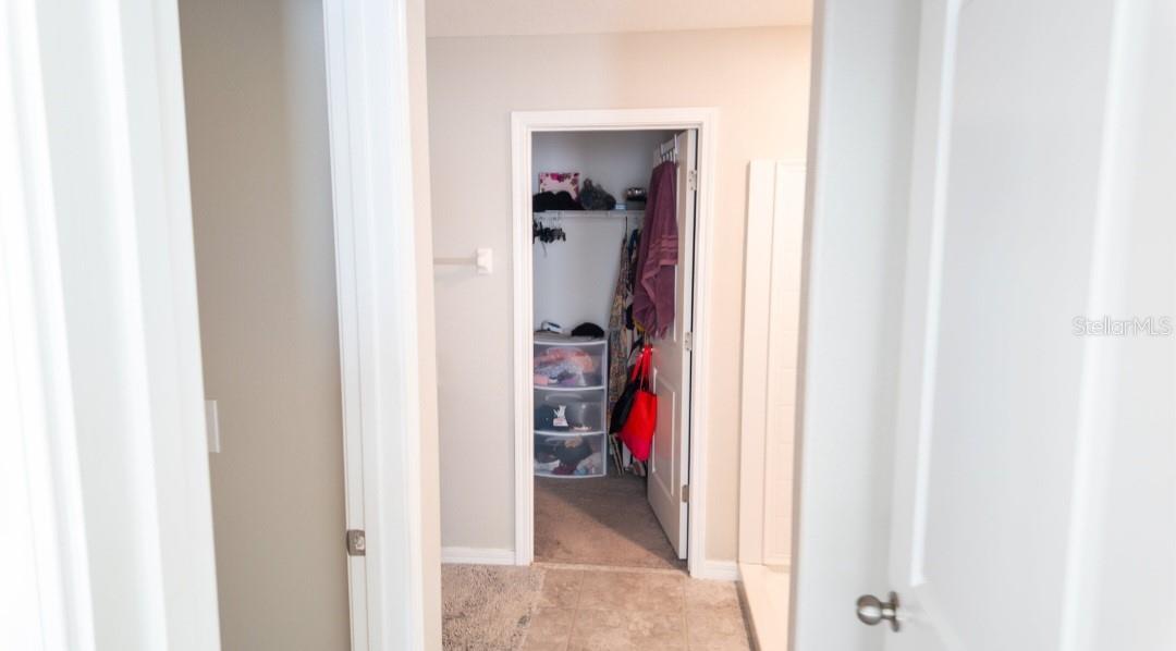 MASTER BATH TO THE WALK-IN CLOSET