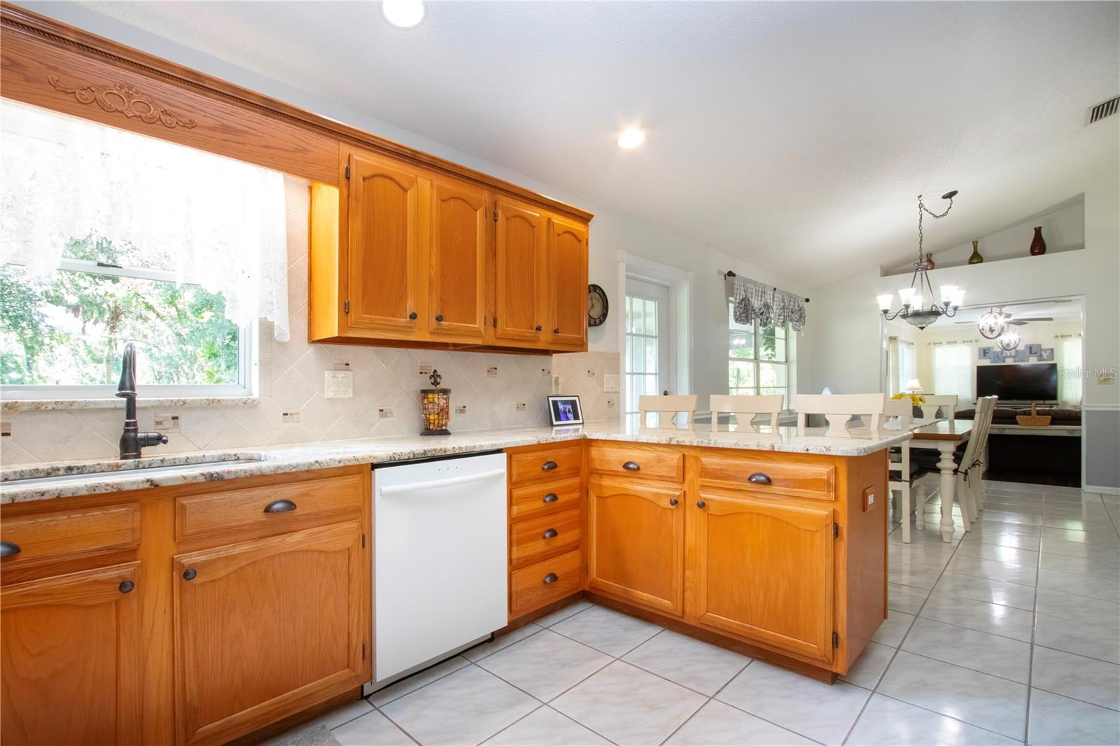 Open Kitchen Concept to Dining Room with Breakfast Bar