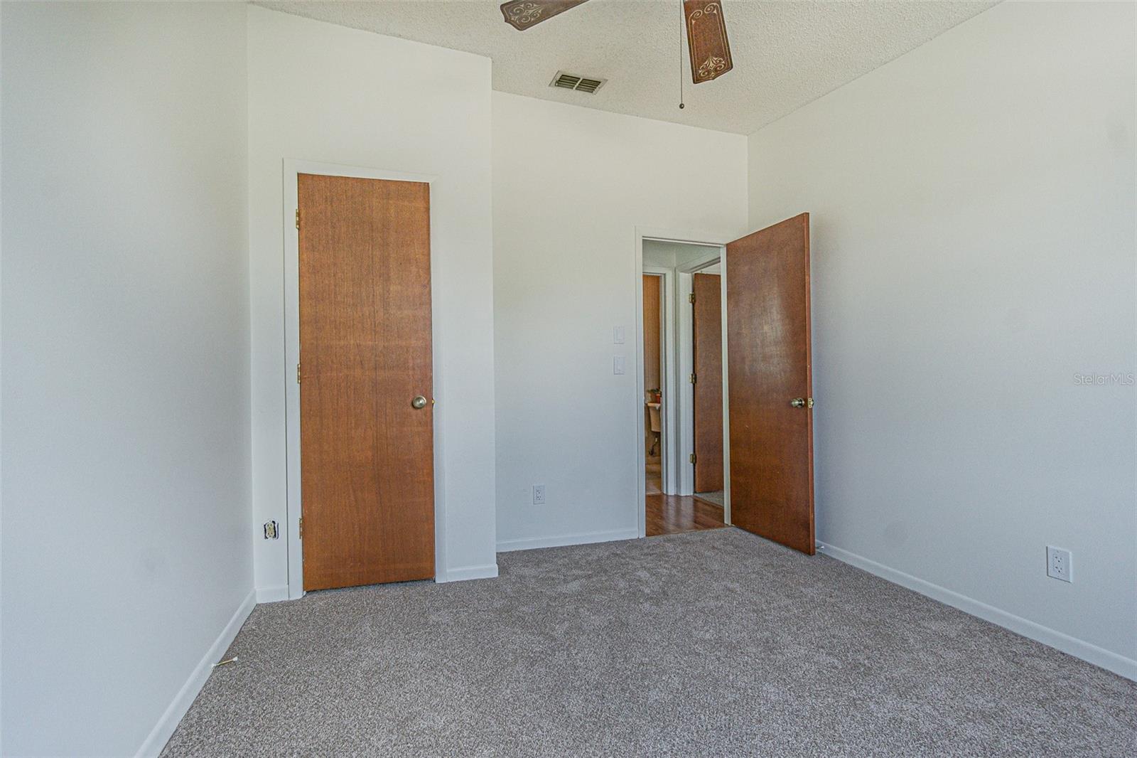 Third Floor Secondary Bedroom with walk-in closet. Brand new carpet and paint.