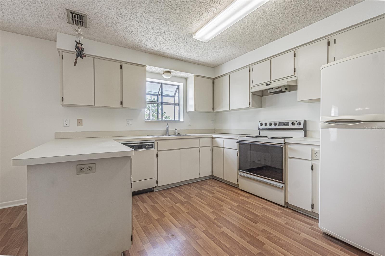 Spacious Kitchen with Breakfast bar on second floor.
