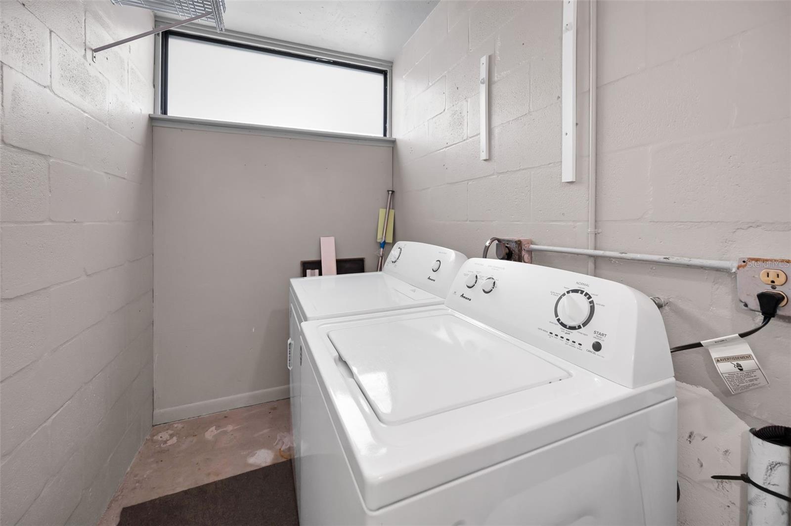 Your own Utility Room outside the unit with full sized washer and dryer