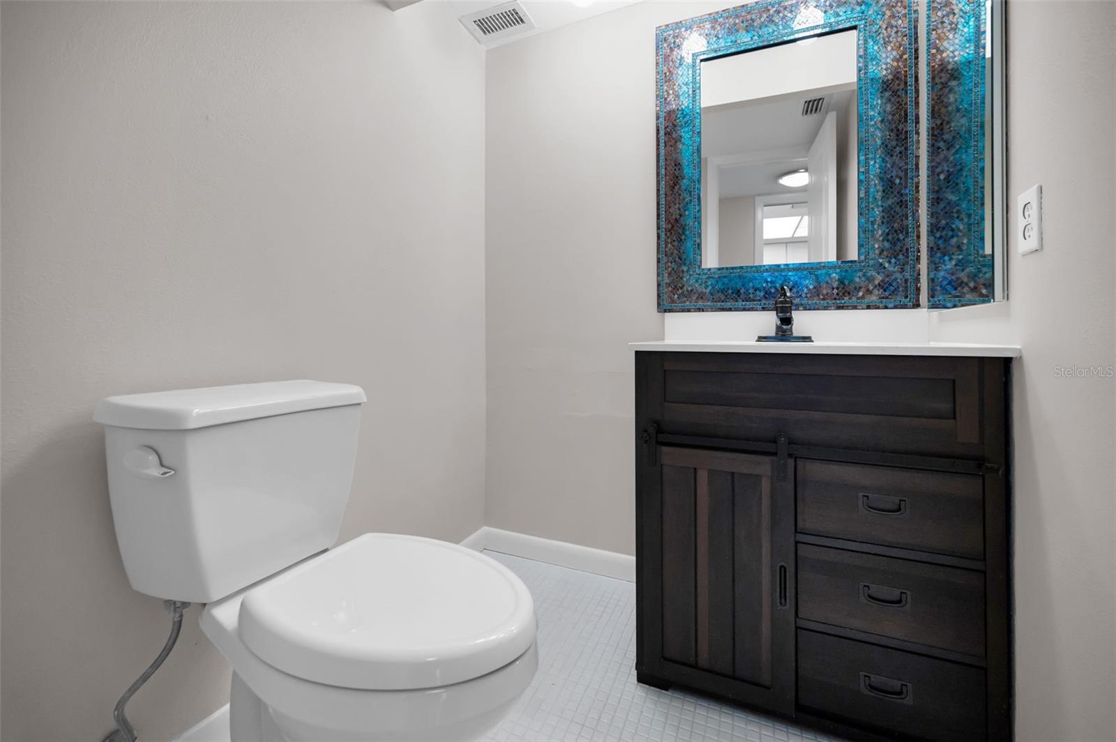 Powder Room / Half bath off the Kitchen and entry