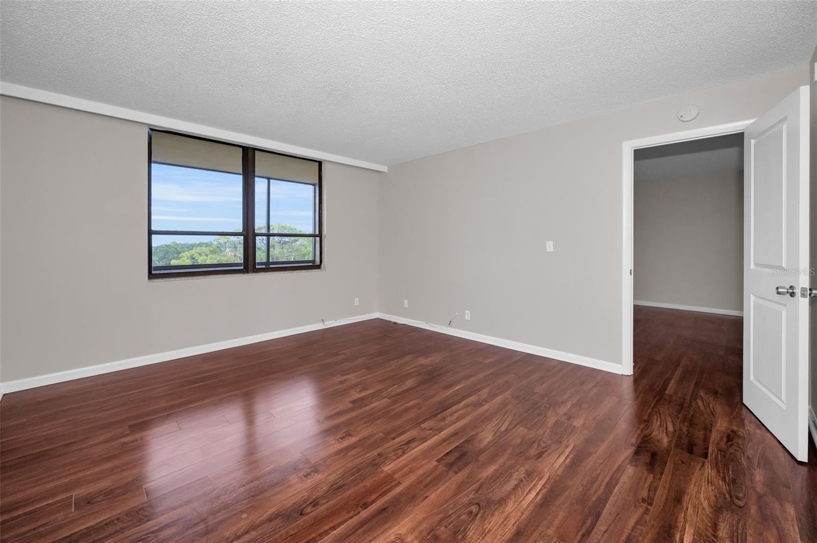 Primary Bedroom with extraordinary Waterfront and Golf Course views!