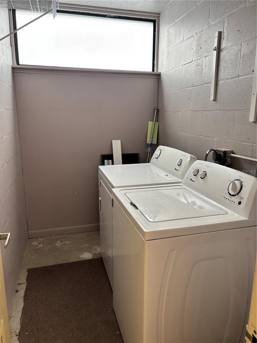 Separate Utility Room with Washer and Dryer
