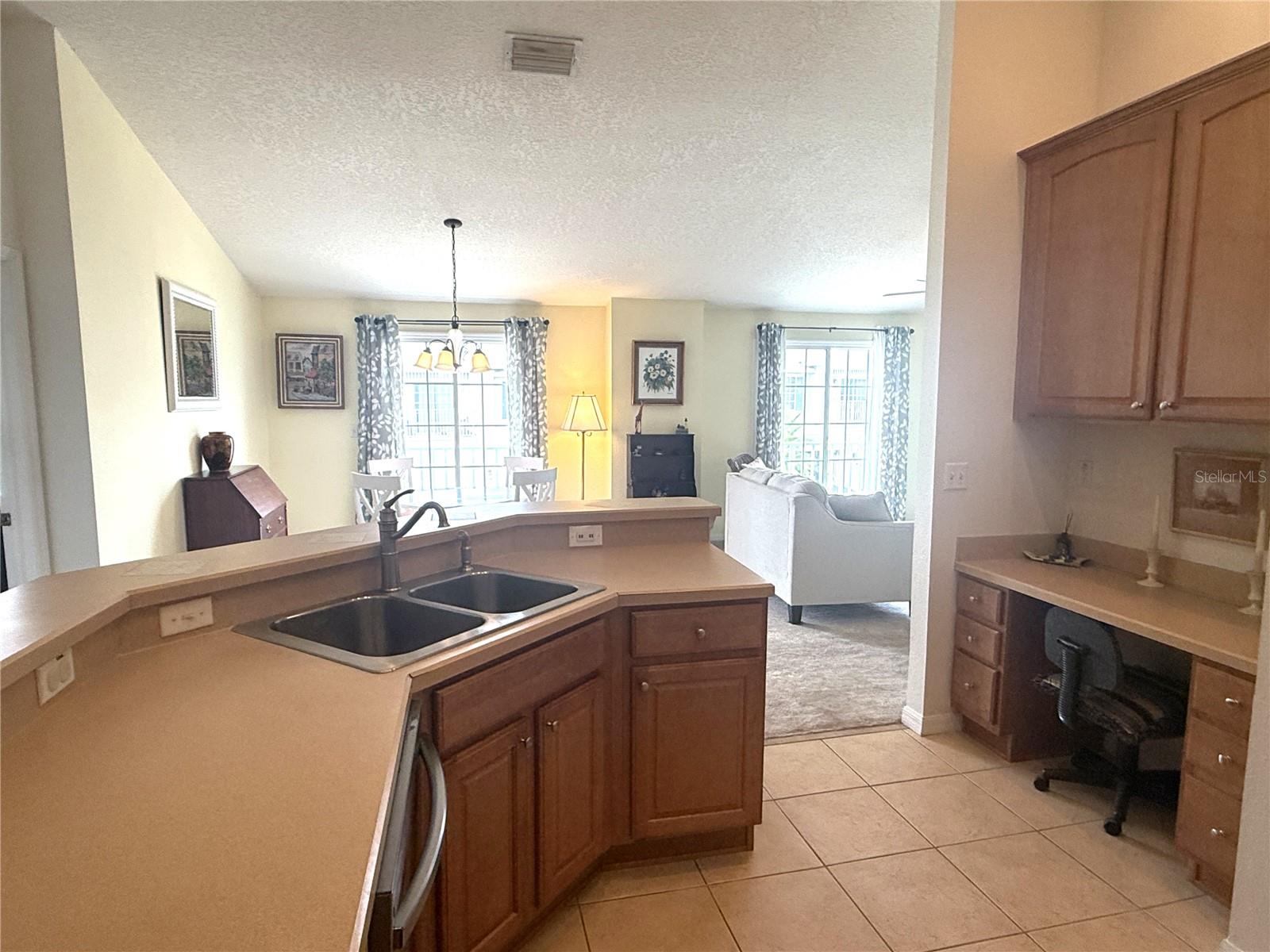Kitchen view to dining and living room